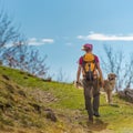 Hiker girl with her Ã¢â¬â¹Ã¢â¬â¹dog Royalty Free Stock Photo